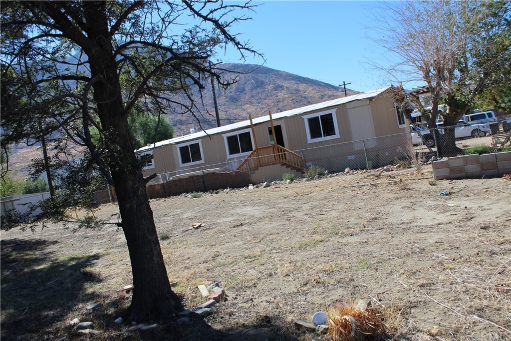 51945 Maxine Avenue Cabazon, CA 92230 - Photo 11 of 21 a backyard of a house with large trees