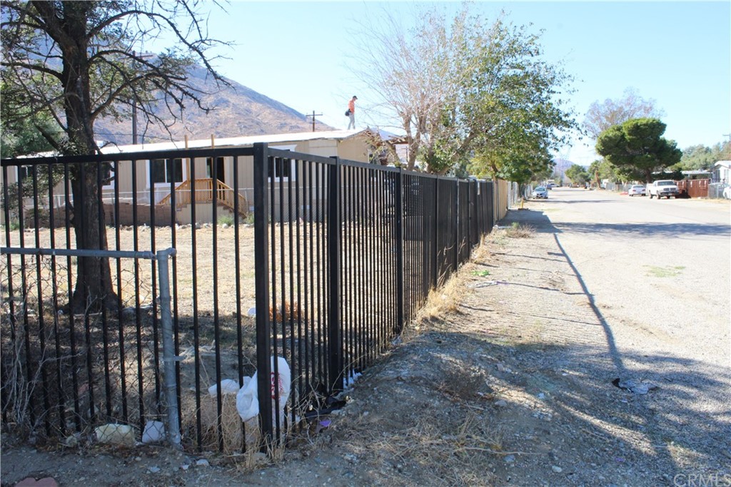 51945 Maxine Avenue Cabazon, CA 92230 - Photo 13 of 21 a view of a wrought iron fences in front of house