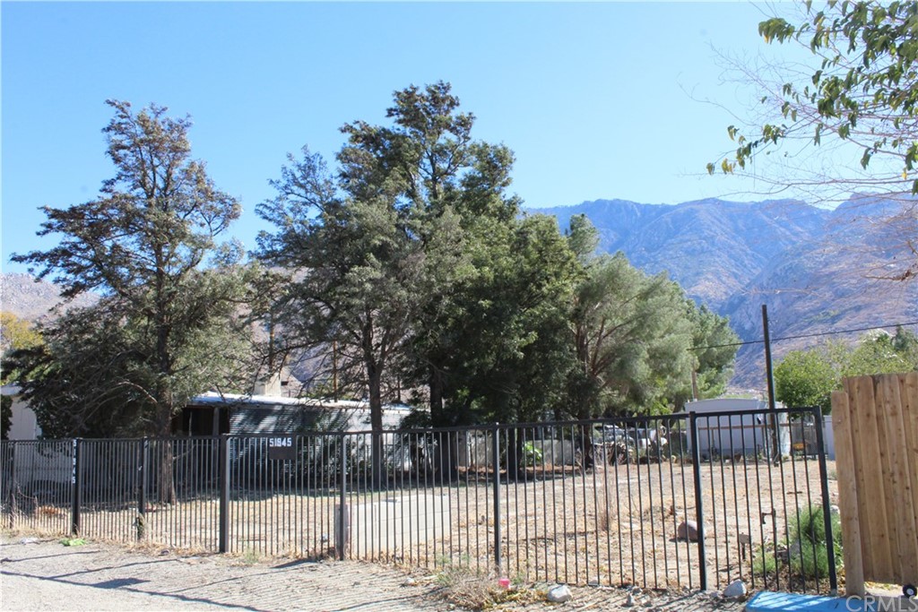 51945 Maxine Avenue Cabazon, CA 92230 - Photo 15 of 21 a view of a house with a small yard