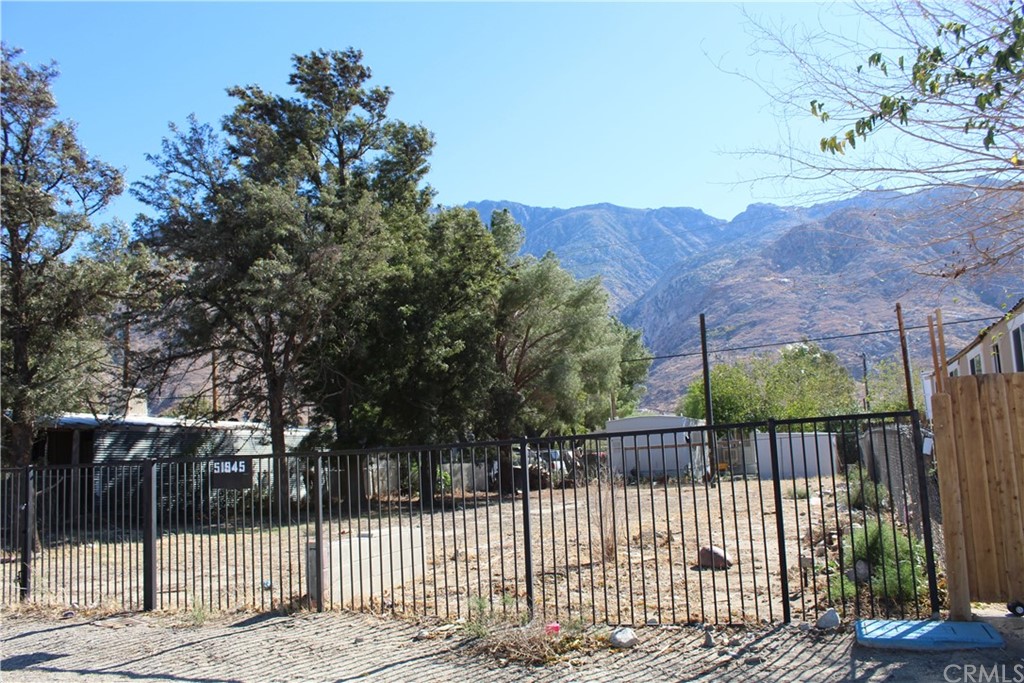 51945 Maxine Avenue Cabazon, CA 92230 - Photo 16 of 21 a view of a wrought iron fences in front of house