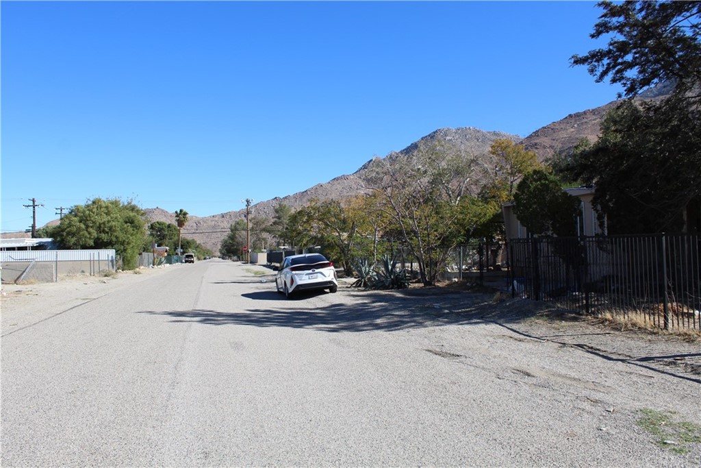 51945 Maxine Avenue Cabazon, CA 92230 - Photo 19 of 21 a view of the road and a building in the background