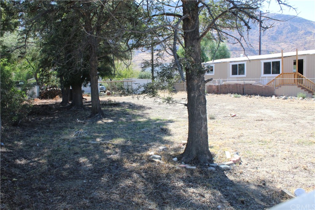 51945 Maxine Avenue Cabazon, CA 92230 - Photo 10 of 21 a front view of a house with a yard
