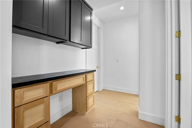 a bathroom with a sink vanity mirror and a bathtub