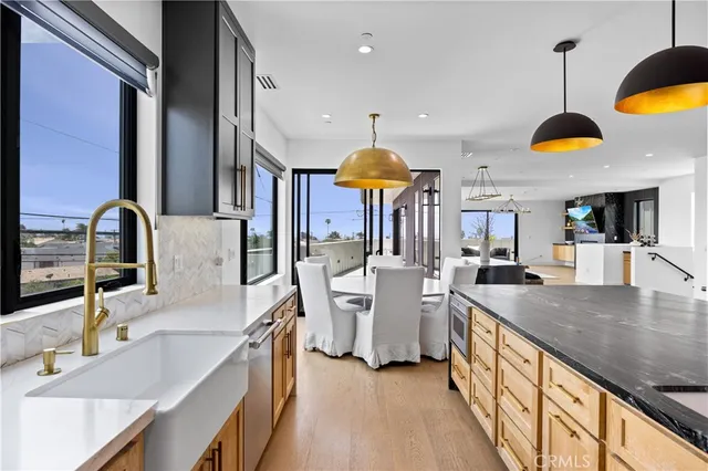 a view of a chairs and table in the balcony