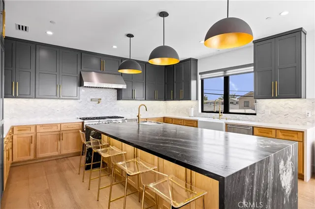 a dining room with furniture and a floor to ceiling window