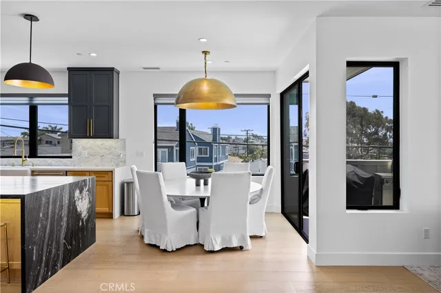 a living room with kitchen island furniture and a wooden floor