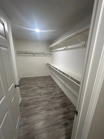 a view of an empty walk in closet