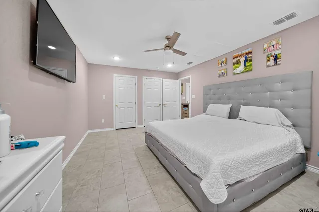 a large white bed in a white room