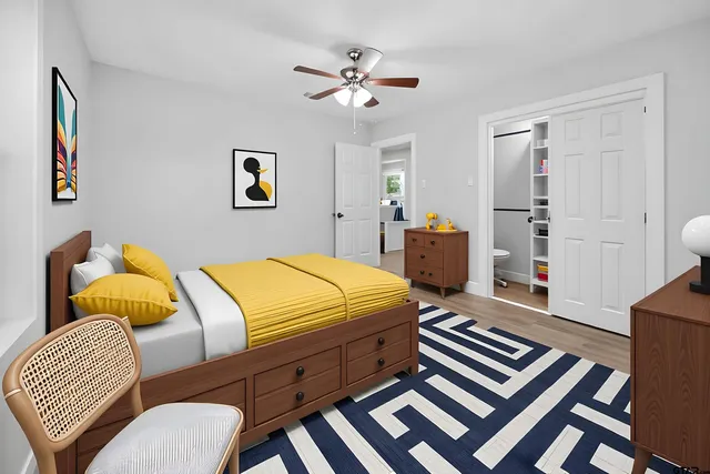 a bedroom with bed and a couch