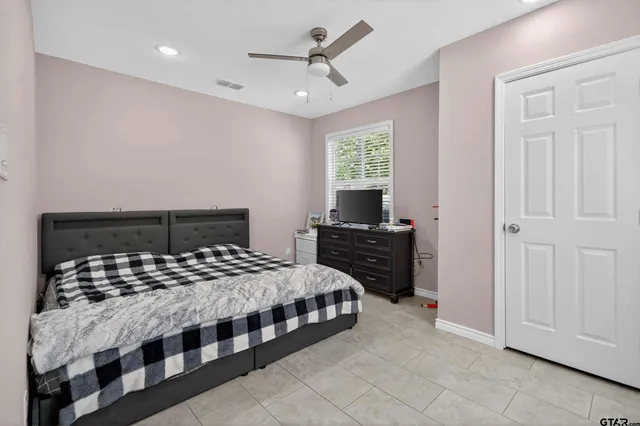 a bedroom with a bed and a table