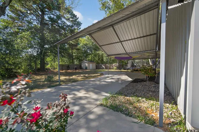 a view of yard with patio