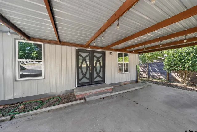a view of a room with wooden walls and roof