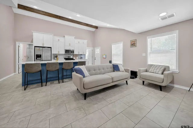 a living room with furniture and a table