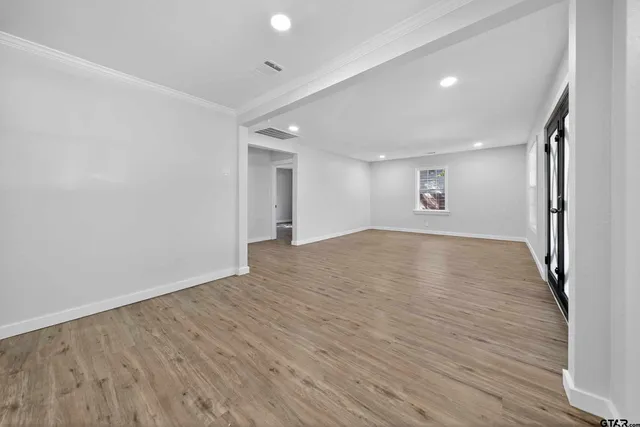 a view of room and wooden floor