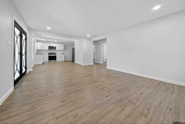 a view of kitchen and wooden floor