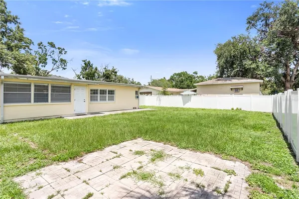 a view of a backyard with a garden and plants