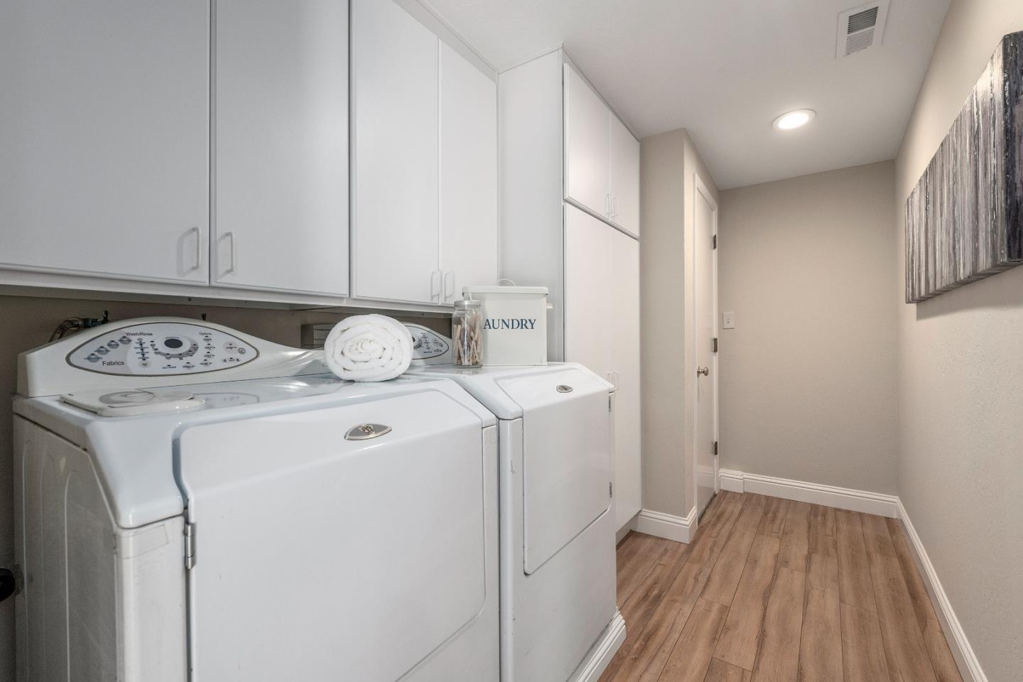 20044 Pacifica Drive Cupertino, CA 95014 - Photo 11 of 23 a view of washer and dryer with wooden floor