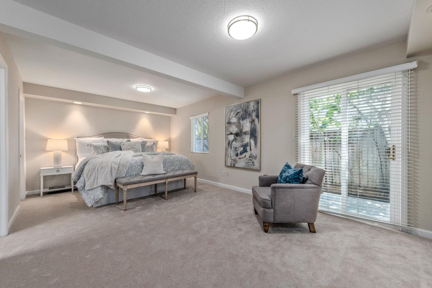 20044 Pacifica Drive Cupertino, CA 95014 - Photo 12 of 23 a spacious bedroom with a bed and a couch