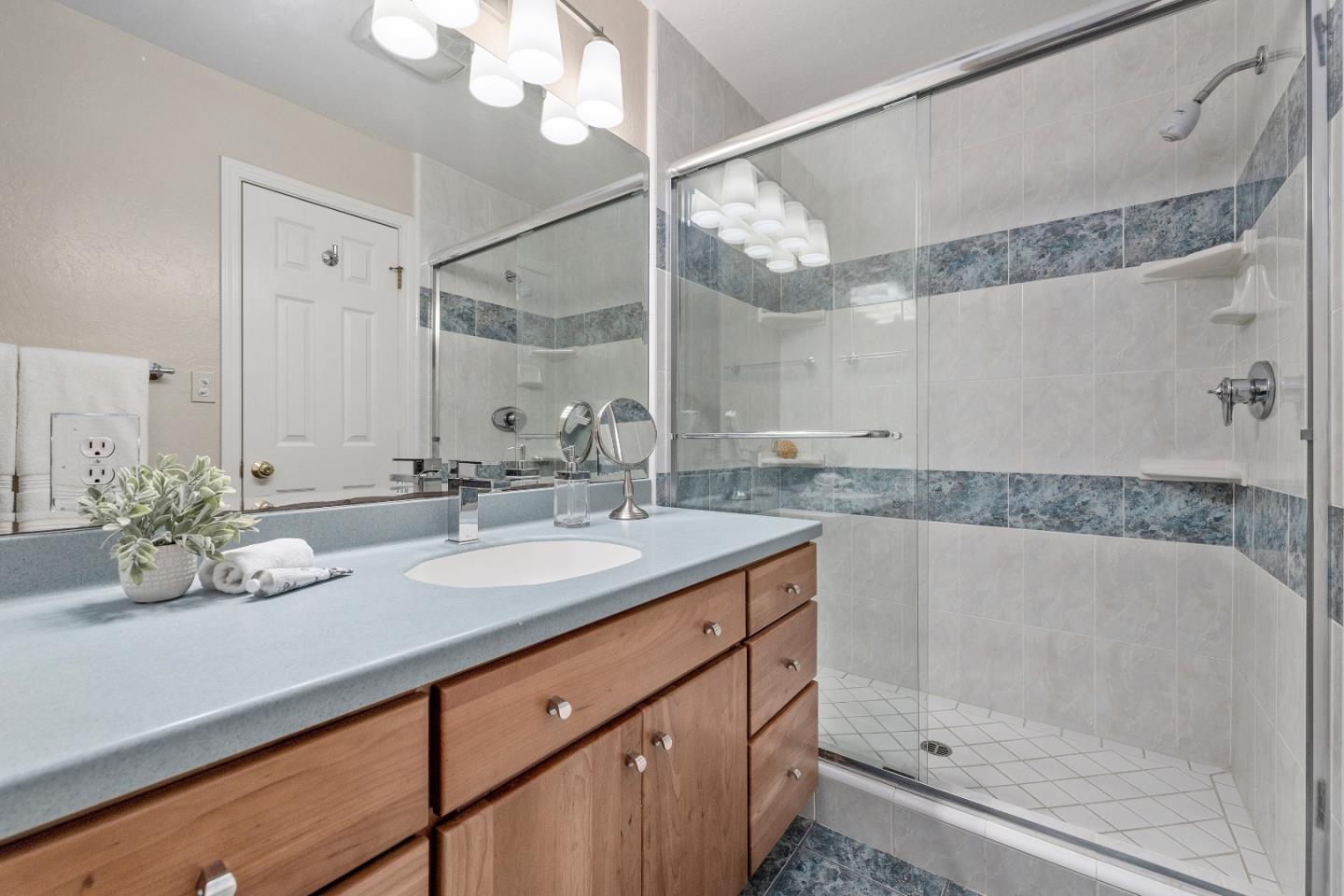 20044 Pacifica Drive Cupertino, CA 95014 - Photo 14 of 23 a bathroom with a double vanity sink mirror and shower