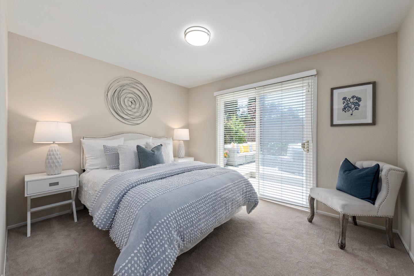 20044 Pacifica Drive Cupertino, CA 95014 - Photo 16 of 23 a bedroom with a bed and a lamp