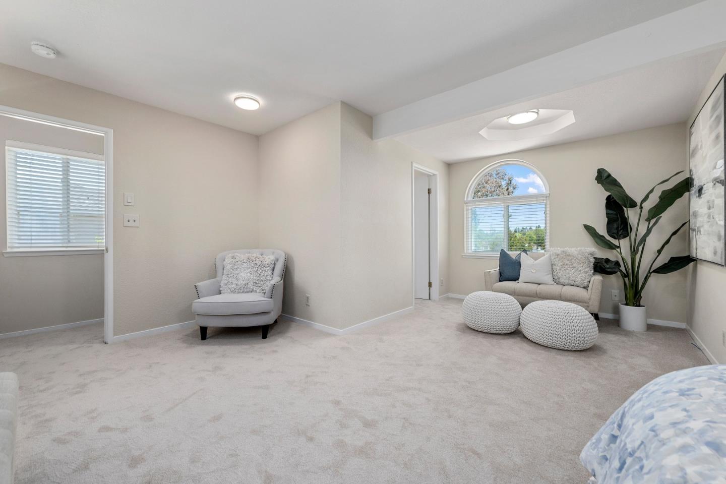 20044 Pacifica Drive Cupertino, CA 95014 - Photo 19 of 23 a living room with furniture and potted plant