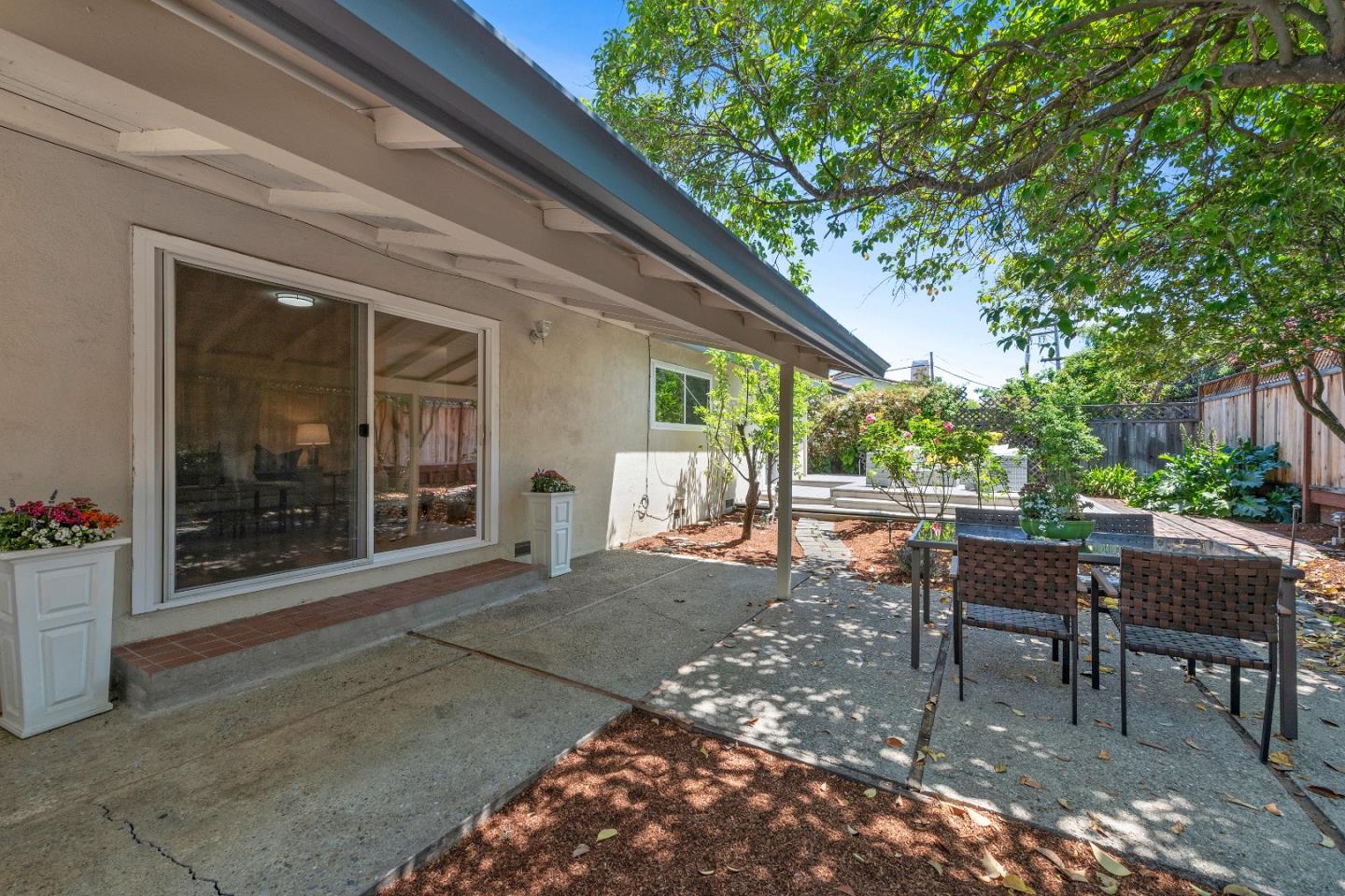 20044 Pacifica Drive Cupertino, CA 95014 - Photo 21 of 23 a view of a patio with table and chairs and potted plants