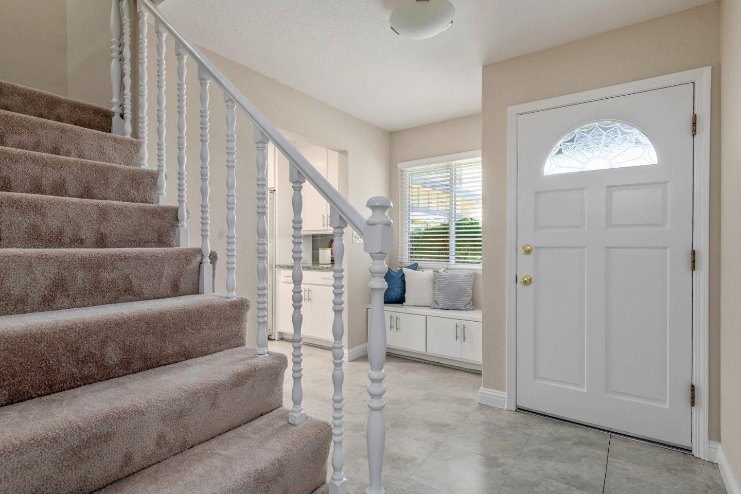 20044 Pacifica Drive Cupertino, CA 95014 - Photo 3 of 23 a living room with furniture and a large window