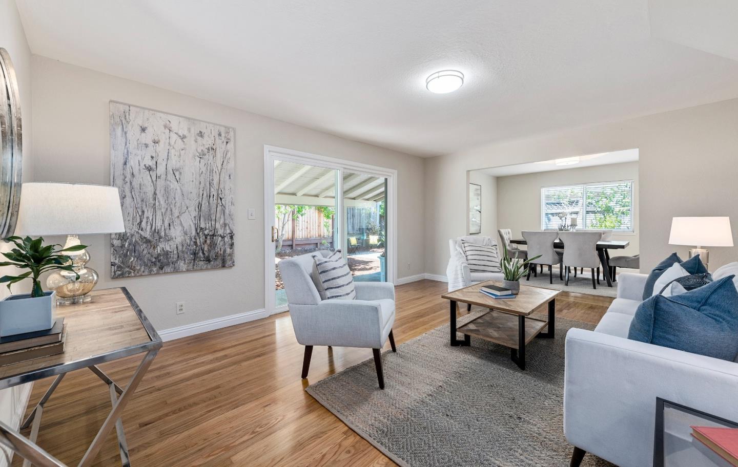 20044 Pacifica Drive Cupertino, CA 95014 - Photo 4 of 23 a living room with furniture and a wooden floor