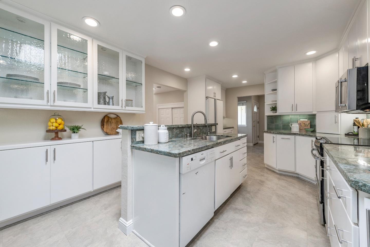 20044 Pacifica Drive Cupertino, CA 95014 - Photo 6 of 23 a kitchen with a sink stove and cabinets