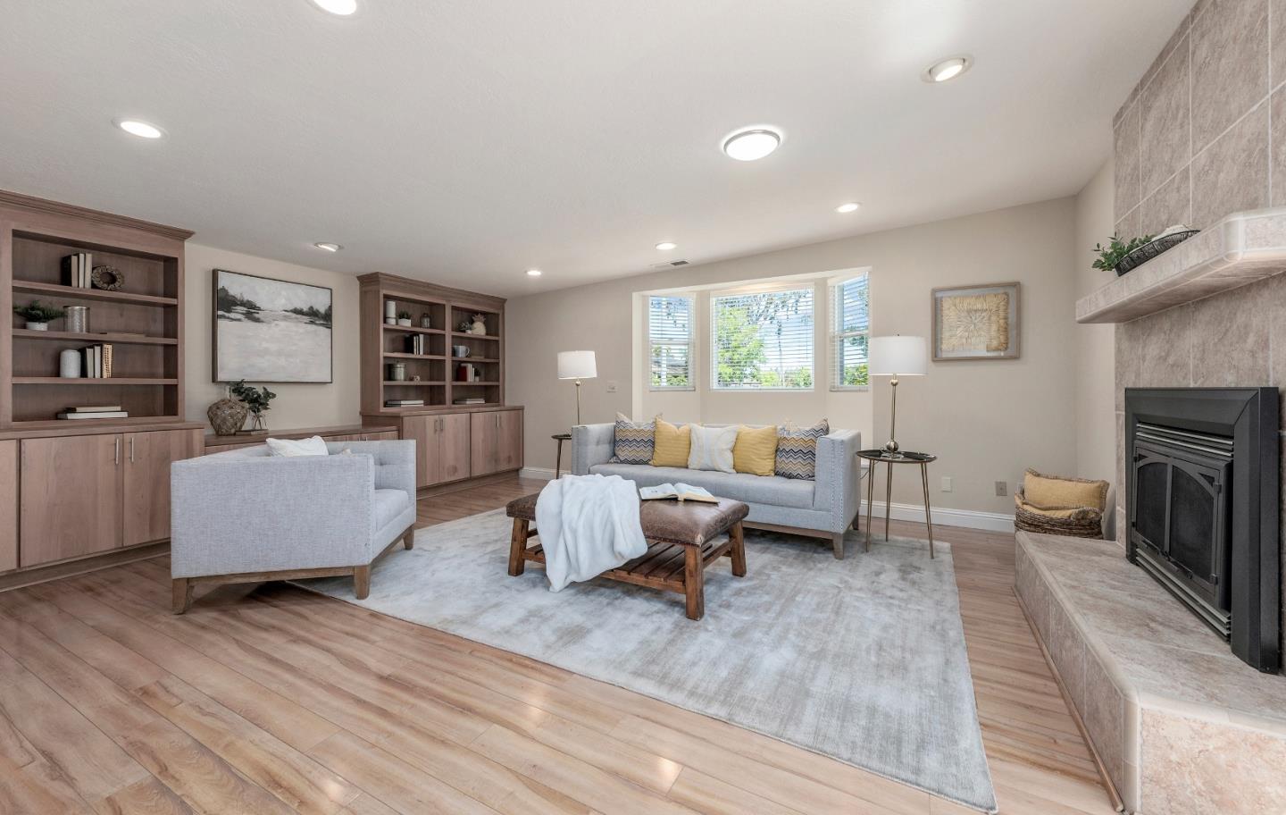 20044 Pacifica Drive Cupertino, CA 95014 - Photo 9 of 23 a living room with furniture and a fireplace