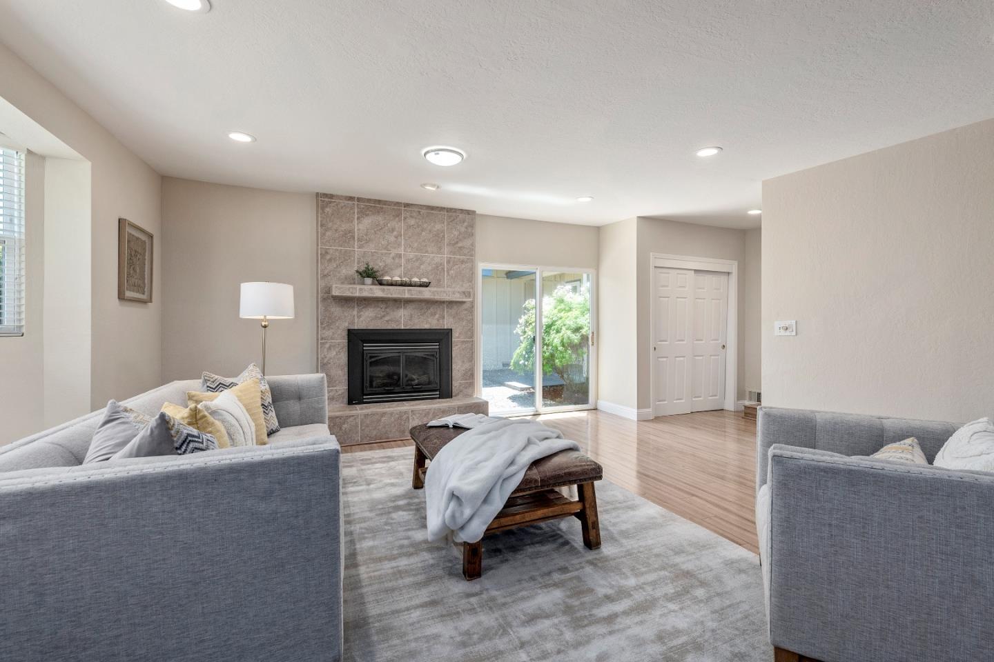 20044 Pacifica Drive Cupertino, CA 95014 - Photo 10 of 23 a living room with furniture and a fireplace