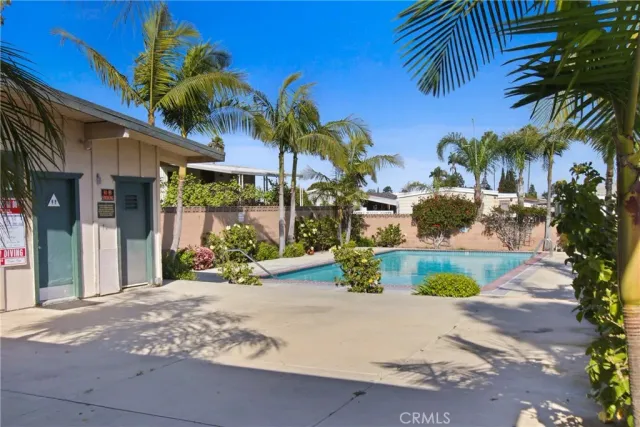 a view of a swimming pool with a lounge chairs