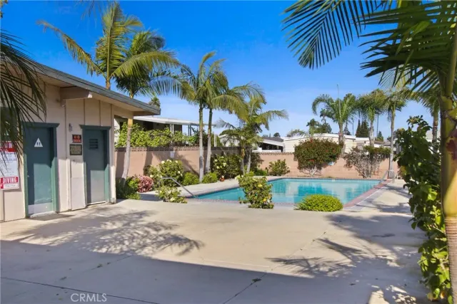 a view of a swimming pool with a lounge chairs