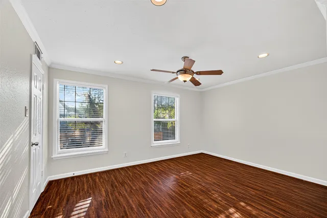 a bathroom with a granite countertop sink a toilet and bathtub