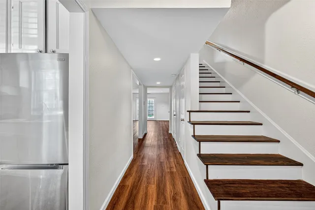 a view of entryway with wooden floor