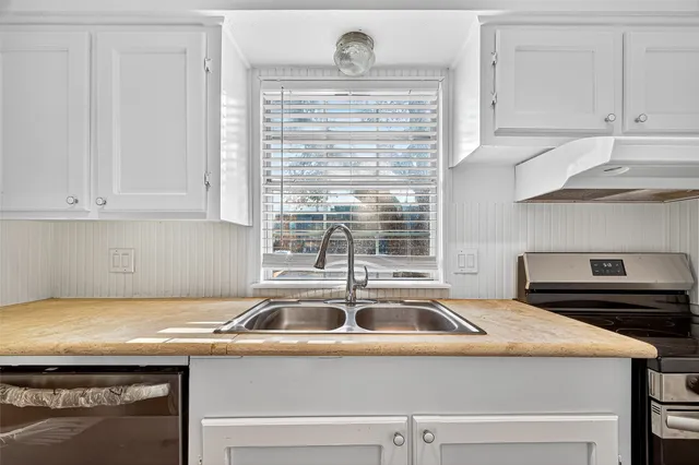 a view of a kitchen sink and dishwasher