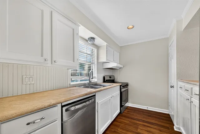 a kitchen with a sink and cabinets