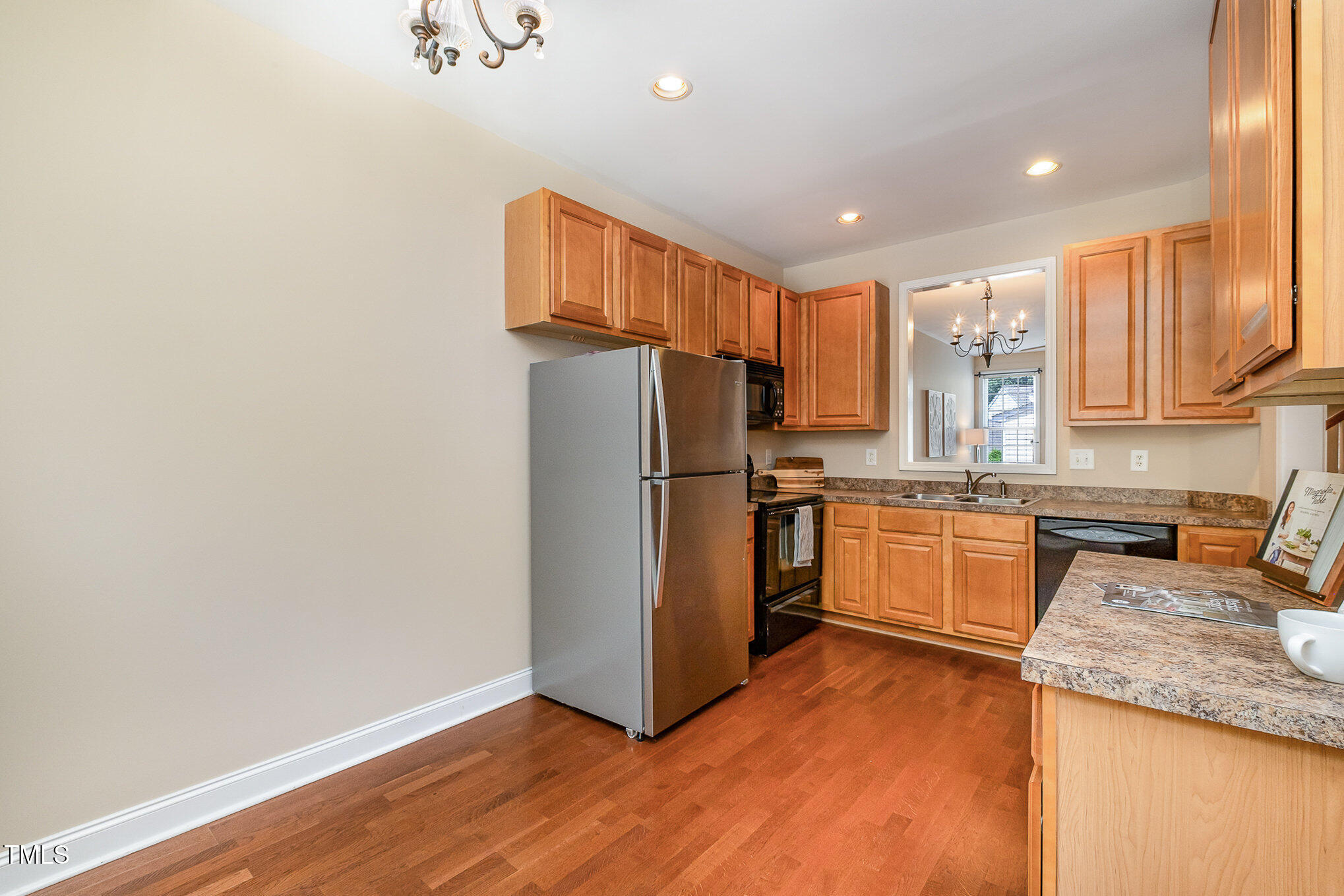 33 Grapevine Trail Durham, NC 27707 - Photo 11 of 30 a kitchen with granite countertop a refrigerator stove top oven and sink