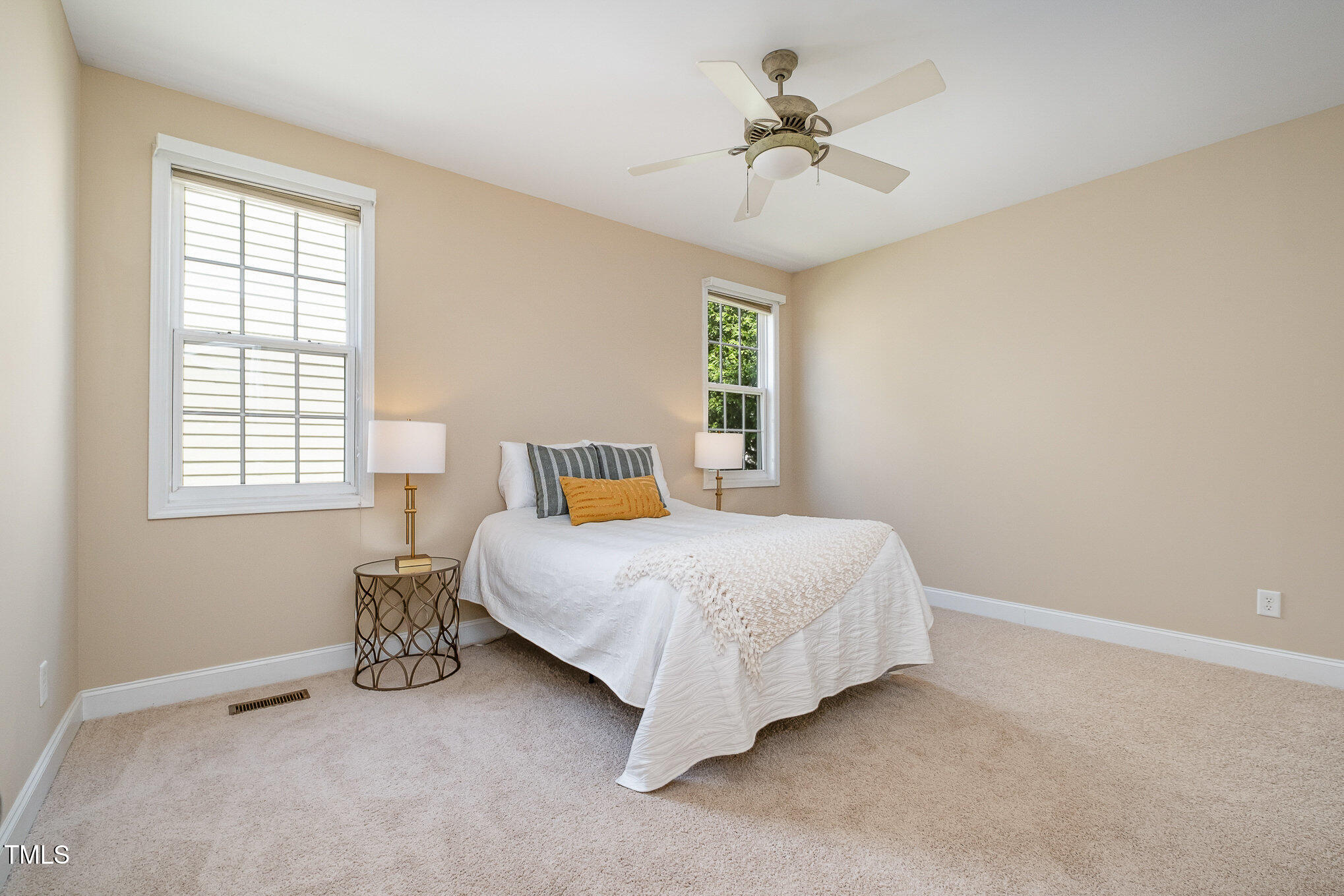 33 Grapevine Trail Durham, NC 27707 - Photo 13 of 30 a bedroom with a bed and a chandelier