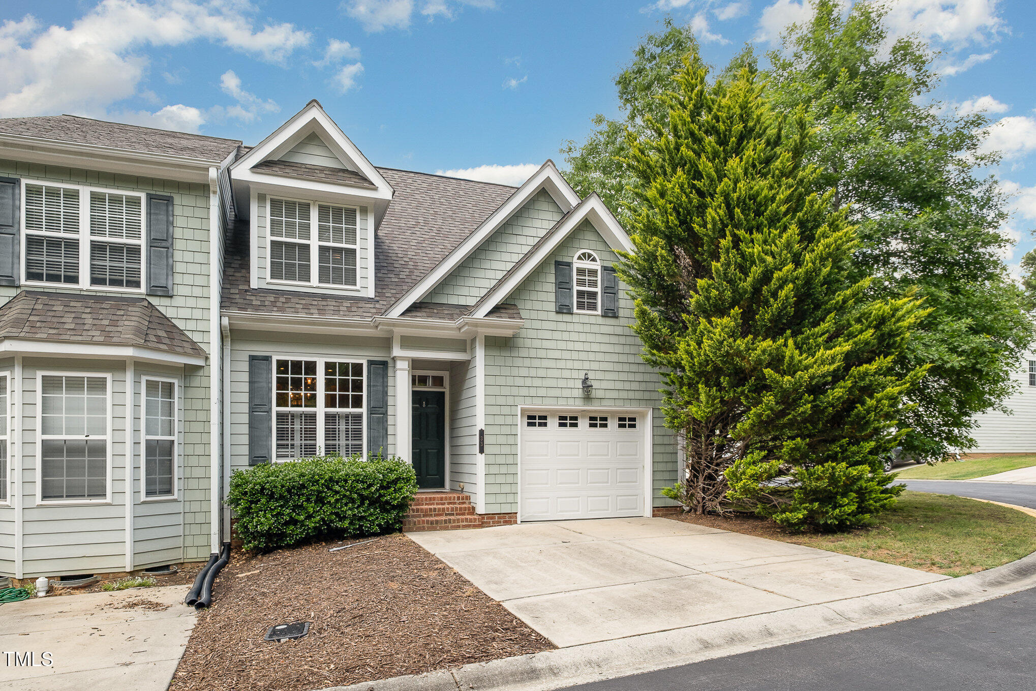 33 Grapevine Trail Durham, NC 27707 - Photo 27 of 30 a front view of a house with a garden