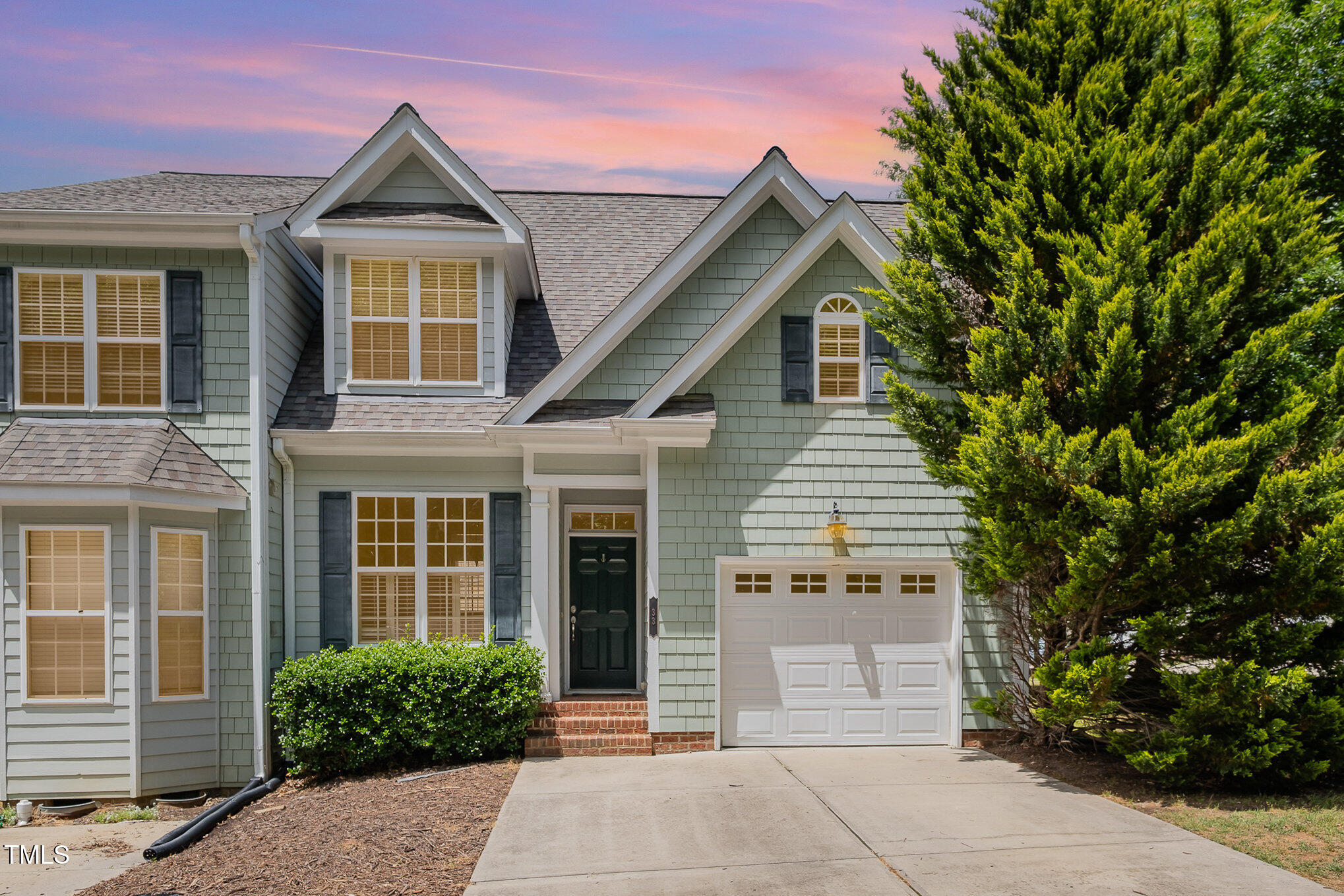 33 Grapevine Trail Durham, NC 27707 - Photo 28 of 30 a front view of a house with a garden