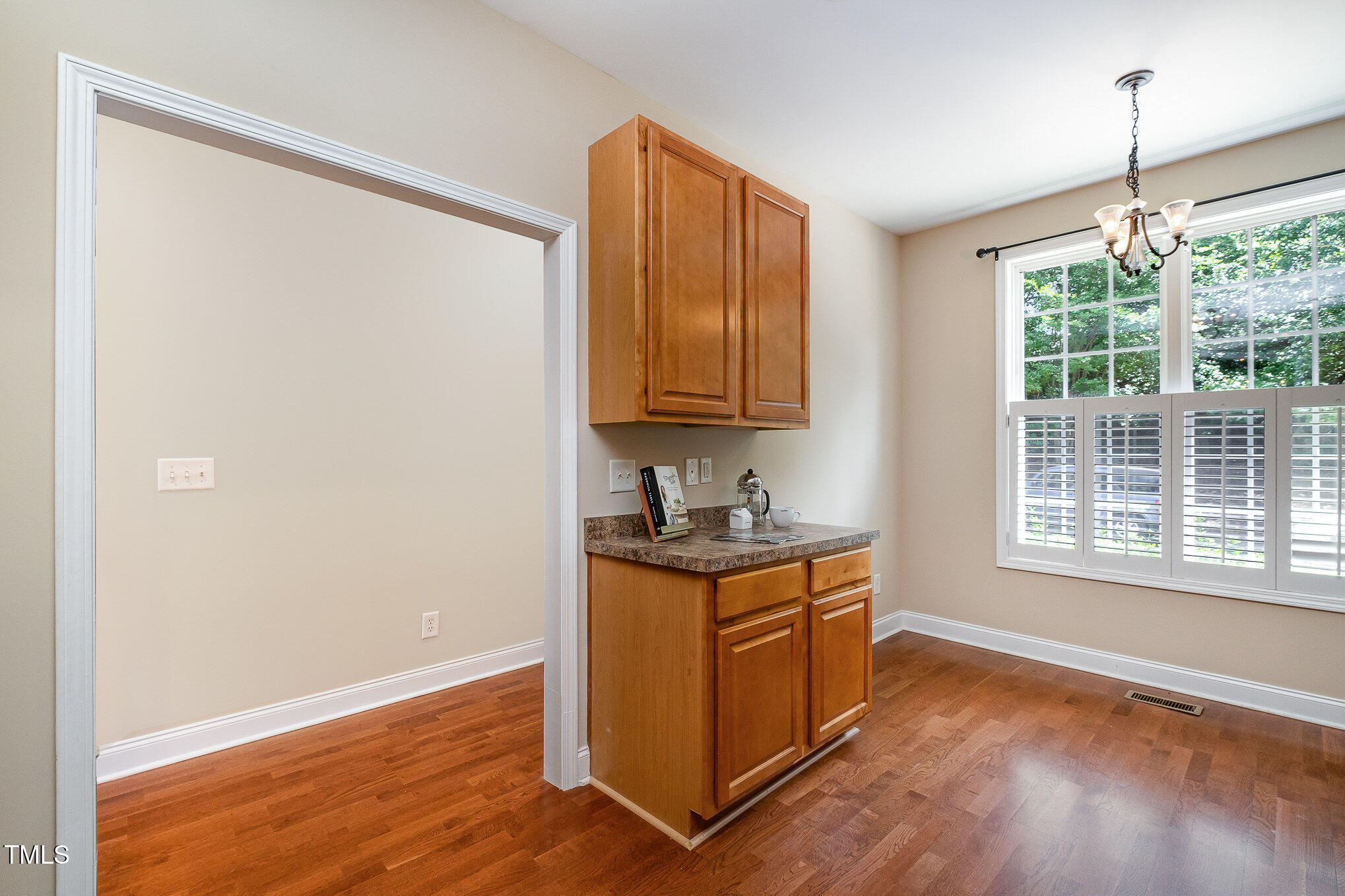 33 Grapevine Trail Durham, NC 27707 - Photo 4 of 30 a view of a kitchen with wooden floor and a window