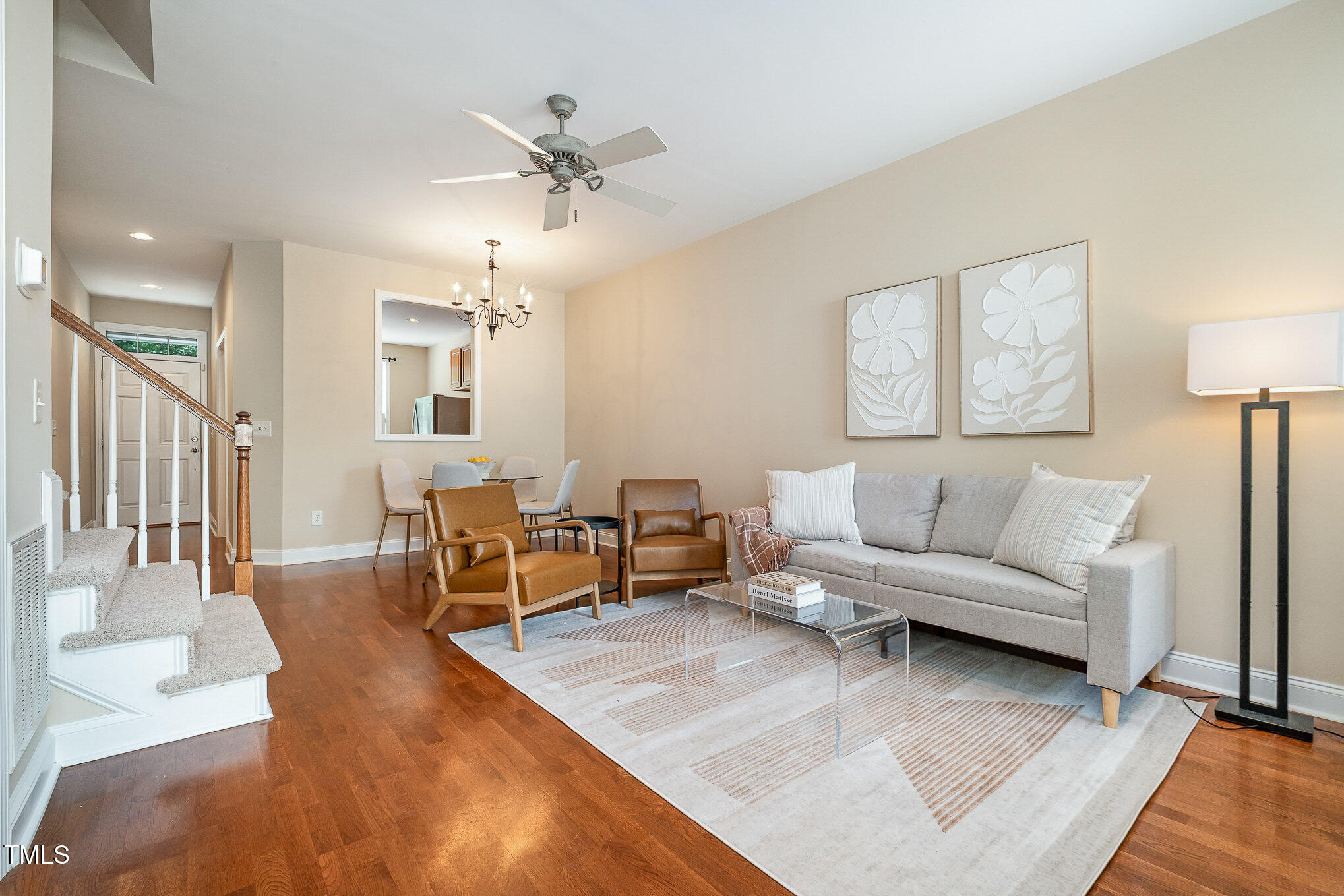 33 Grapevine Trail Durham, NC 27707 - Photo 7 of 30 a living room with furniture and a chandelier