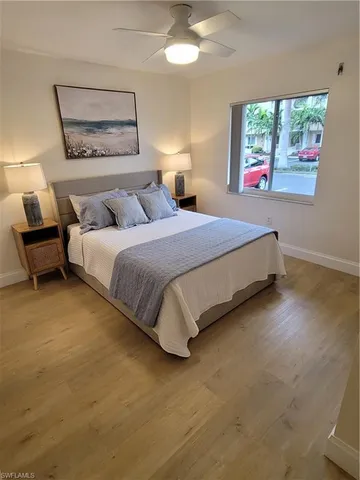 a bedroom with bed and window