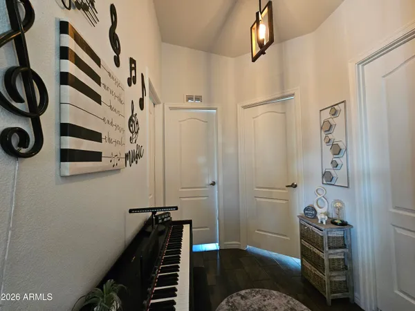 a bedroom with a bed and a chandelier