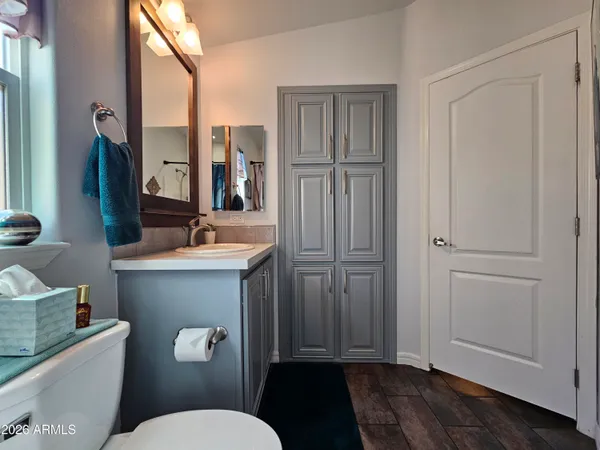 a bedroom with a bed and a table in it