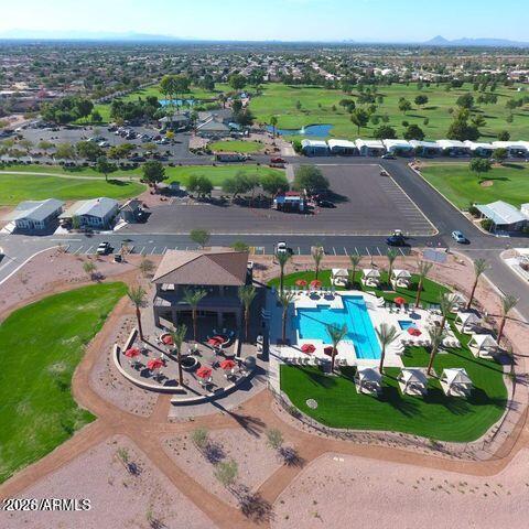 650 North Hawes Road, Unit 3406 Mesa, AZ 85207 - Photo 44 of 45 a view of a swimming pool with a garden and seating area