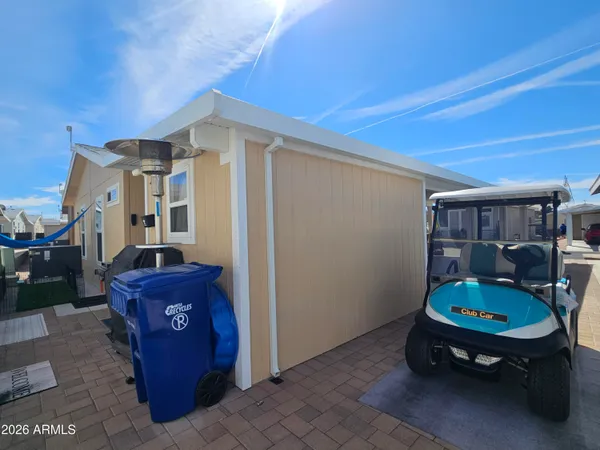a backyard of a house with outdoor seating