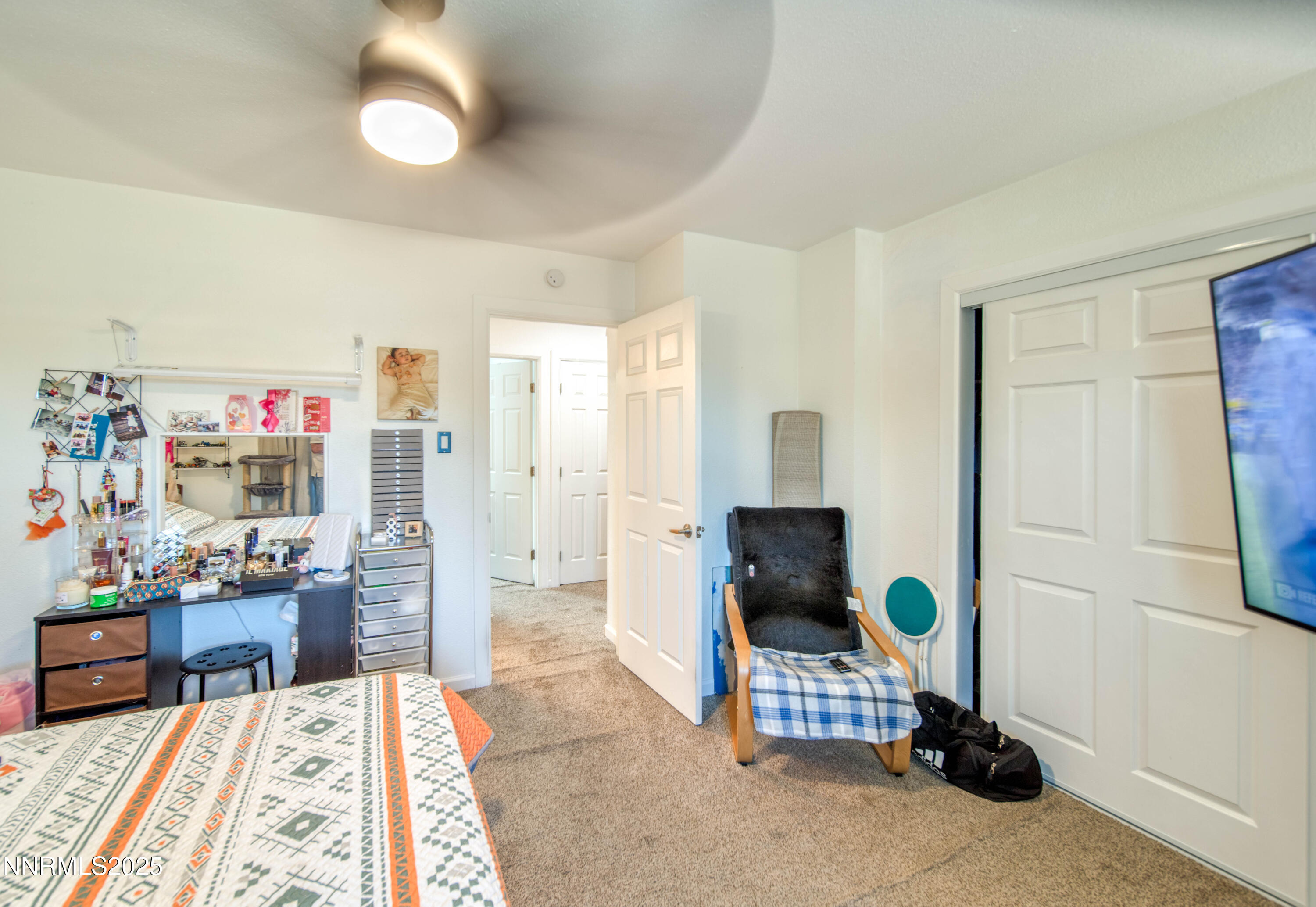2168 Cannonball Road Sparks, NV 89431 - Photo 12 of 21 a living room with furniture and a flat screen tv
