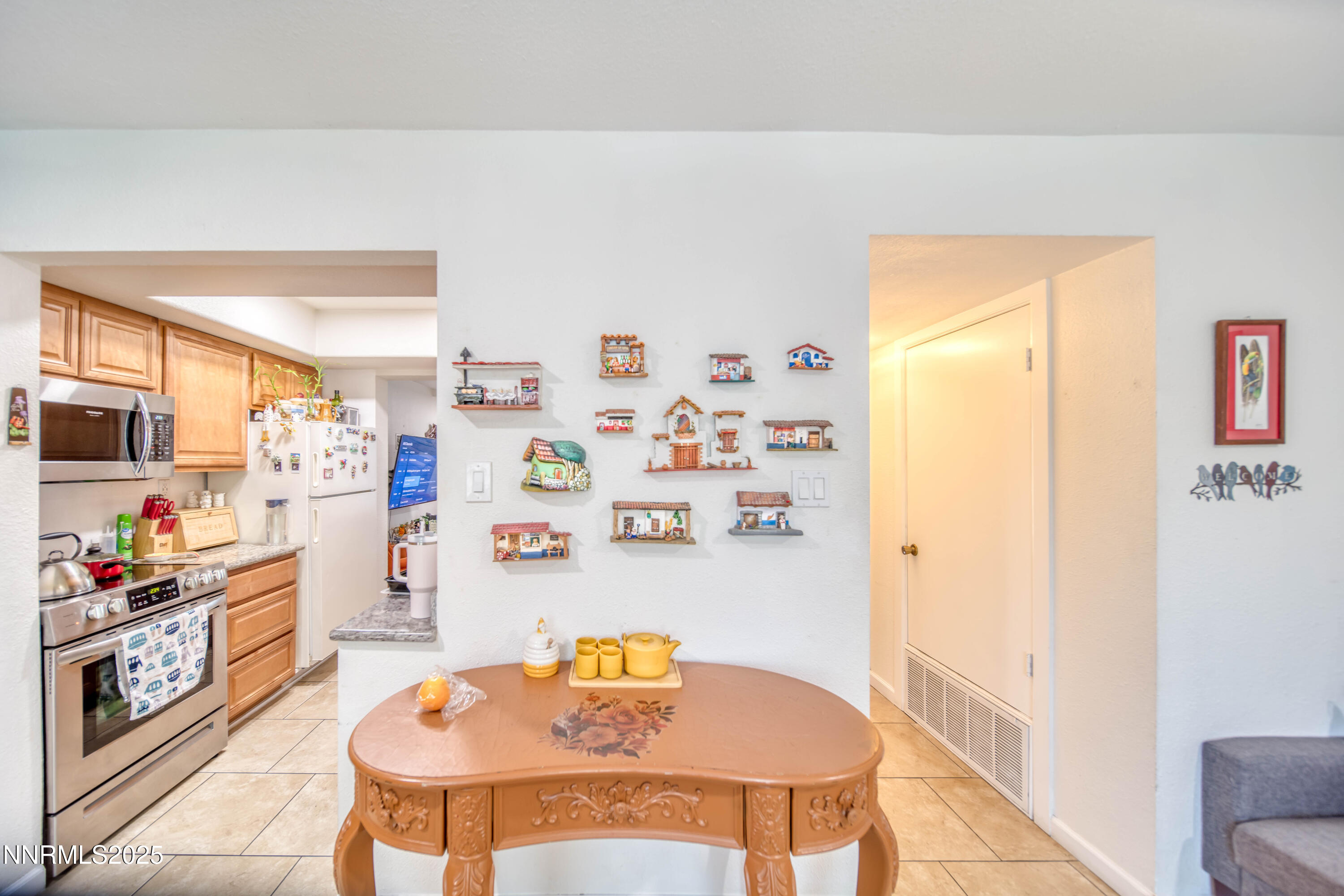 2168 Cannonball Road Sparks, NV 89431 - Photo 5 of 21 a dining room with a table and chairs